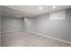 The finished basement room has wood-look floors, recessed lighting, and white-shuttered windows at 11645 Lincoln St, Northglenn, CO 80233