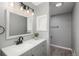 Bathroom with modern vanity, white countertop, and recessed lighting at 11645 Lincoln St, Northglenn, CO 80233