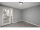 This bedroom has wood-look floors and a glass block accent next to the door at 11645 Lincoln St, Northglenn, CO 80233
