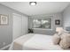 Bedroom with neutral decor, hardwood floors, and a window view at 11645 Lincoln St, Northglenn, CO 80233