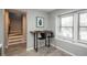Charming breakfast nook with a wooden table, black stools, and a bright window view at 11645 Lincoln St, Northglenn, CO 80233