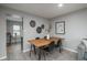 Inviting dining area with wooden table, seating for four, and contemporary wall decor at 11645 Lincoln St, Northglenn, CO 80233