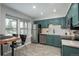 Bright kitchen featuring stainless steel appliances, granite countertops, and adjacent breakfast nook at 11645 Lincoln St, Northglenn, CO 80233