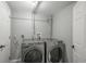 Well-lit laundry room includes side by side washer and dryer at 11645 Lincoln St, Northglenn, CO 80233