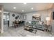 Open-concept living room and dining area with contemporary decor and gray walls at 11645 Lincoln St, Northglenn, CO 80233