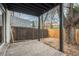 Enclosed patio area with large tree and privacy fence at 11645 Lincoln St, Northglenn, CO 80233