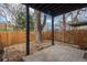 Covered patio with concrete slab and wooden fence at 11645 Lincoln St, Northglenn, CO 80233