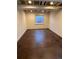 Basement space with polished floors, exposed ceiling and a window which create an industrial-chic aesthetic at 11506 Greenbriar Ln, Parker, CO 80138