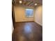 Basement with stained concrete floor, offering a versatile space with natural light from a window, ready for customization at 11506 Greenbriar Ln, Parker, CO 80138