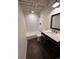 Bathroom with updated vanity and fixtures, combined with a tiled shower/bathtub, create a modern and functional space at 11506 Greenbriar Ln, Parker, CO 80138