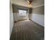 This bedroom offers carpeted floors, a ceiling fan, and natural light from the window at 11506 Greenbriar Ln, Parker, CO 80138