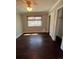 This bedroom offers hardwood floors, a ceiling fan, closet, and natural light from the window at 11506 Greenbriar Ln, Parker, CO 80138