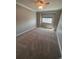 This bedroom offers carpeted floors, a ceiling fan, and natural light from the window at 11506 Greenbriar Ln, Parker, CO 80138