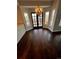 Bright breakfast nook with dark wood floors, windows, and a door leading to the deck at 11506 Greenbriar Ln, Parker, CO 80138
