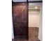 Walk-in closet with a rustic sliding barn door entrance provides ample storage space for organization and style at 11506 Greenbriar Ln, Parker, CO 80138
