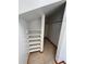 This walk-in closet has custom shelving, carpet, and offers lots of storage space at 11506 Greenbriar Ln, Parker, CO 80138