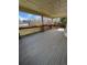 An eye-level, covered deck with recessed lighting and views of a well maintained backyard and residential area beyond at 11506 Greenbriar Ln, Parker, CO 80138