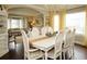 Open dining room with a view into the living area, creating a seamless and inviting space for entertaining at 11506 Greenbriar Ln, Parker, CO 80138