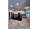 Modern kitchen with granite countertops, stainless steel appliances, and bright lighting at 11506 Greenbriar Ln, Parker, CO 80138