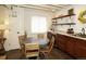 Convenient kitchenette featuring wood cabinets, stone countertops, and stainless steel appliances at 11506 Greenbriar Ln, Parker, CO 80138