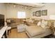 Comfortable living room with a sectional sofa, neutral decor, and plenty of natural light at 11506 Greenbriar Ln, Parker, CO 80138