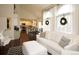 Open-concept living room featuring modern décor, dining area, and bright natural light at 11506 Greenbriar Ln, Parker, CO 80138