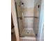 The shower features glass doors, modern fixtures, and custom tilework at 11506 Greenbriar Ln, Parker, CO 80138