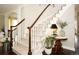Elegant staircase with white railings and wooden handrail adds a touch of sophistication to the home's interior at 11506 Greenbriar Ln, Parker, CO 80138