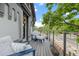 Relaxing balcony featuring modern railings and comfortable seating with tree-lined street views at 3410 Pecos St, Denver, CO 80211