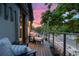Cozy balcony with comfortable seating, perfect for enjoying the neighborhood views during sunset at 3410 Pecos St, Denver, CO 80211