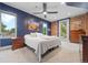 Bedroom with abundant natural light, fan, brick wall accent, and ensuite access at 3410 Pecos St, Denver, CO 80211
