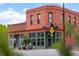 Charming corner building, Pinwheel Coffee, featuring a brick facade, large windows, and street view at 3410 Pecos St, Denver, CO 80211