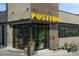 Modern building Postino, features wood and brick accents, large windows, and stylish exterior at 3410 Pecos St, Denver, CO 80211