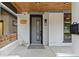 Welcoming front porch featuring a modern door, stylish lighting, and a charming address plaque at 3410 Pecos St, Denver, CO 80211