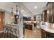 Modern kitchen with a stylish island, dark wood cabinetry, and stainless steel appliances at 3410 Pecos St, Denver, CO 80211