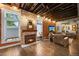 Cozy living room features exposed brick and stone accents, fireplace and a comfortable seating area at 3410 Pecos St, Denver, CO 80211