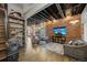Spacious living room featuring exposed brick, stylish decor, and a comfortable seating area at 3410 Pecos St, Denver, CO 80211