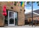 Exterior view of Fox and the Hen restaurant with outdoor seating under a tent at 3410 Pecos St, Denver, CO 80211