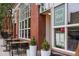 Exterior shot of Duo Restaurant with a brick facade, outdoor seating and large windows at 3410 Pecos St, Denver, CO 80211
