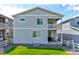 Back exterior featuring a green lawn and a small outdoor patio at 4505 Cholla Trl, Castle Rock, CO 80104