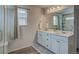 A lovely bathroom featuring a dual sink vanity and a glass enclosed shower at 4505 Cholla Trl, Castle Rock, CO 80104