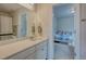 Bright bathroom with a vanity and view into the connected bedroom at 4505 Cholla Trl, Castle Rock, CO 80104