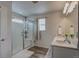 A well-lit bathroom featuring a shower and double sink vanity at 4505 Cholla Trl, Castle Rock, CO 80104
