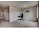 Spacious carpeted bedroom with desk, chair, horse art and adjacent to hallway at 4505 Cholla Trl, Castle Rock, CO 80104