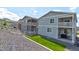 Charming gray two-story home featuring inviting balconies and meticulous landscaping at 4505 Cholla Trl, Castle Rock, CO 80104
