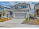 Two-story house with a two car garage and a small front porch at 4505 Cholla Trl, Castle Rock, CO 80104