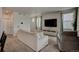 Cozy living room with a comfortable sofa, media console, and ample natural light at 4505 Cholla Trl, Castle Rock, CO 80104