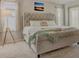 A large bedroom featuring a bed and natural light streaming in from the windows at 4505 Cholla Trl, Castle Rock, CO 80104