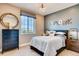 Stylish bedroom with ample natural light, modern decor, and an 