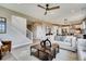 Spacious living room with an open floor plan, seamlessly connecting to the kitchen and dining areas at 13794 Honey Hush Trl, Parker, CO 80134